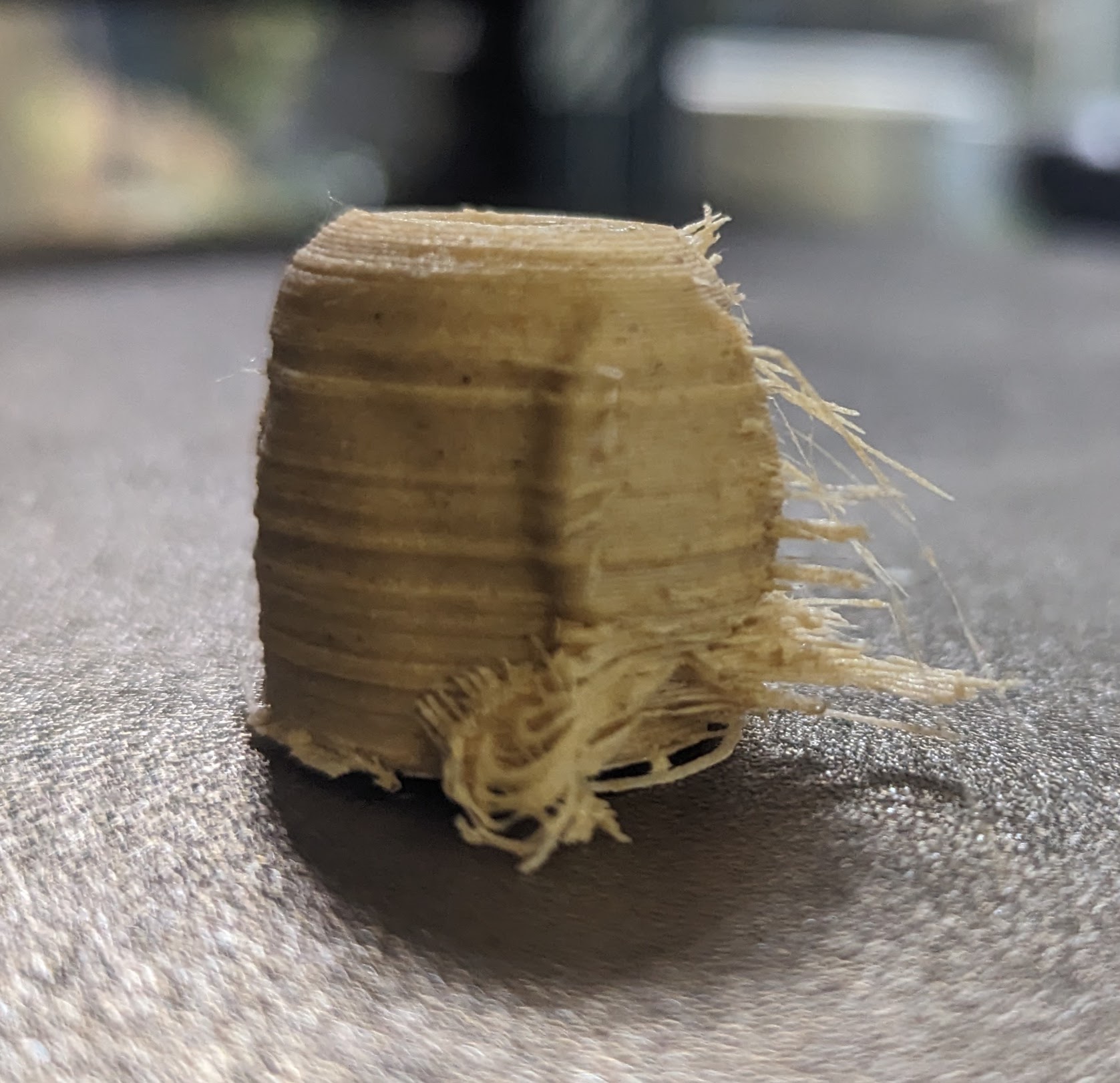 A close up of the body of one of the owls, with strings and spirals of filament that look like splinters in snapped wood.